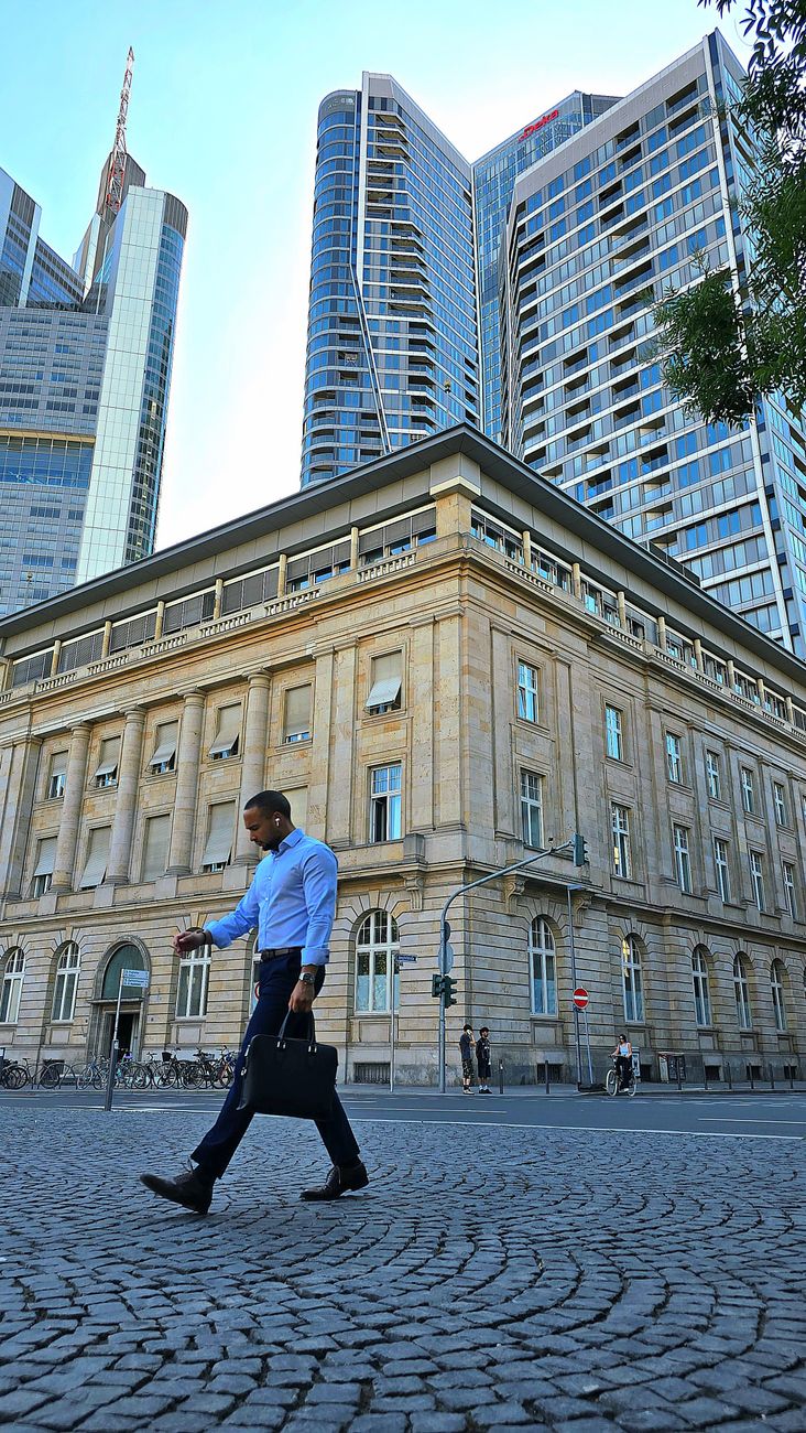 businessman walking in frankfurt s financial district