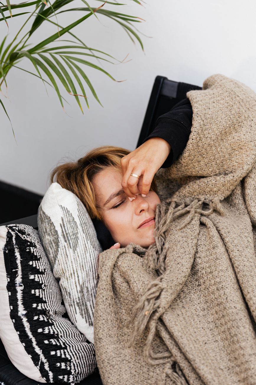 a woman covered with a blanket